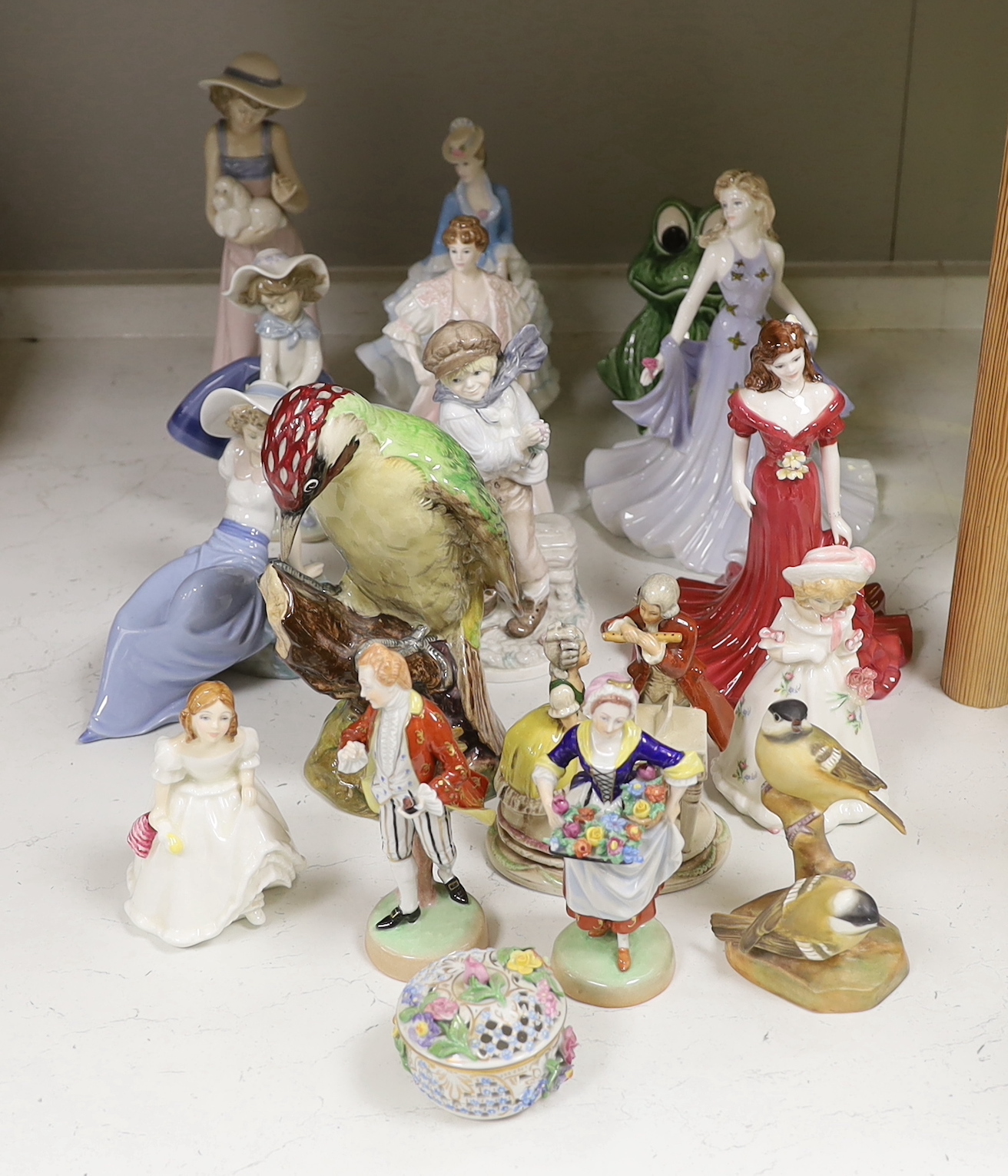 A large Beswick figure of a Woodpecker, Royal Worcester model of Coal Tits, five Coalport figurines and mixed Doulton, Lladro Nao and other figurines etc, tallest 22cm high